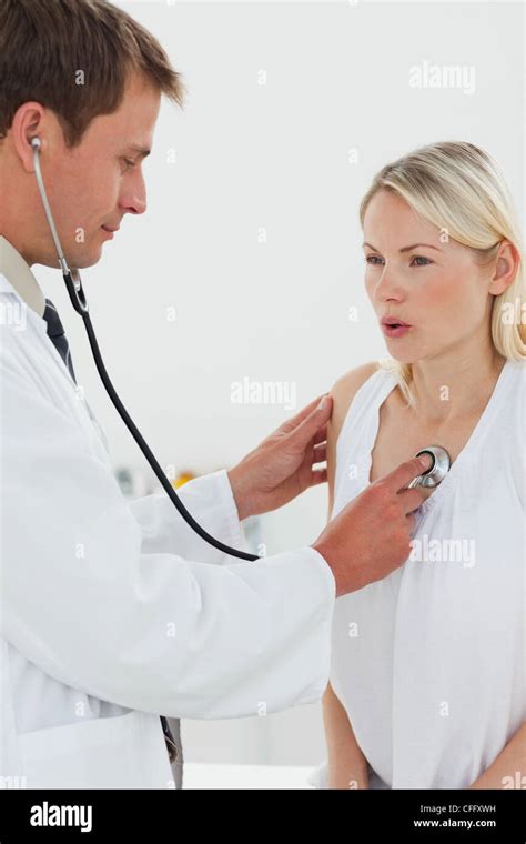 Doctor Checking Patients Heart Beat Hi Res Stock Photography And Images