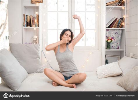 Woman Waking Up And Stretching — Stock Photo © Makidotvn 151217358