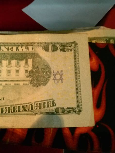 What does this stamp mean? Found it on the back of a 20 dollar bill at ...