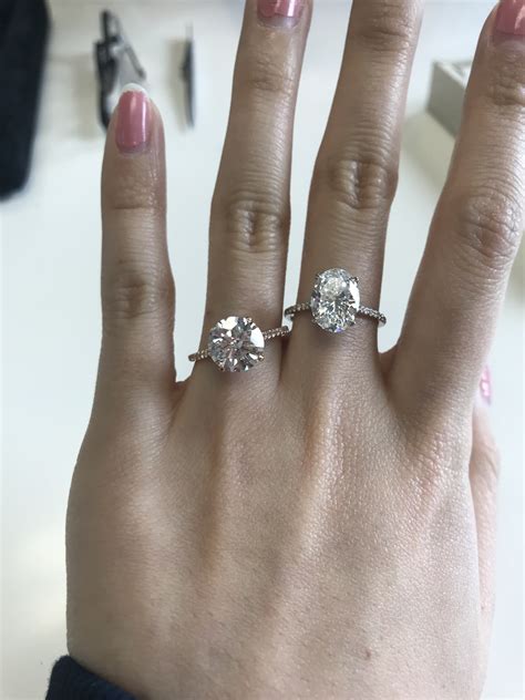 Comparison pics of 2.5 and 3 carat ovals + round diamonds! [pic heavy]