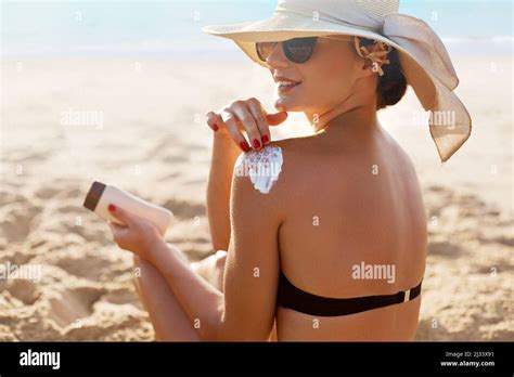 Skin Care Beauty Woman Applying Sunscreen Cream On Tanned Shoulder Body Sun Protection