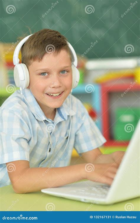 Portrait Of Boy With Headphones Using Laptop Stock Image Image Of