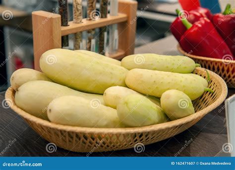 Fresh Crisp Spiky White Cucumbers Lie In A Basket In The Window Of The