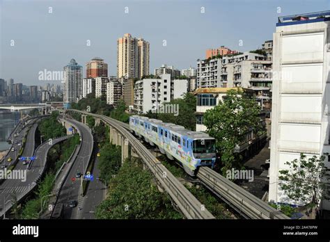 A Line Monorail Train Departs From Liziba Station On The Chongqing