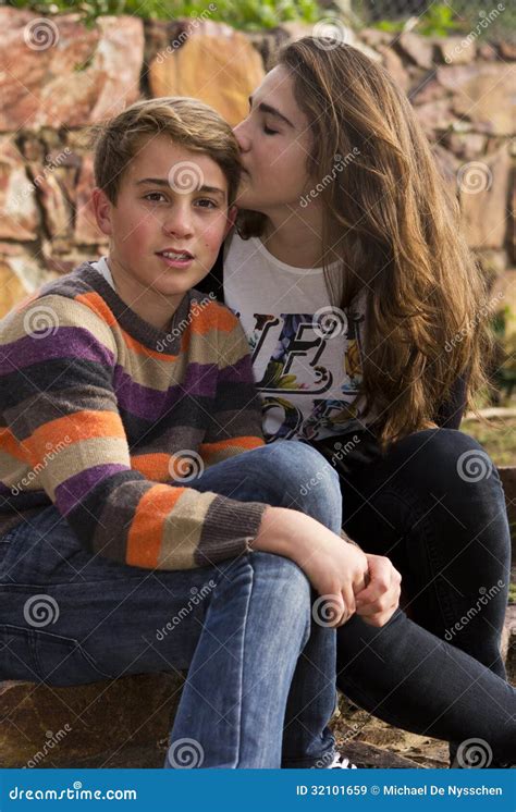 Sister Kissing And Hugging Disabled Little Brother In Wheelchair Royalty Free Stock Image