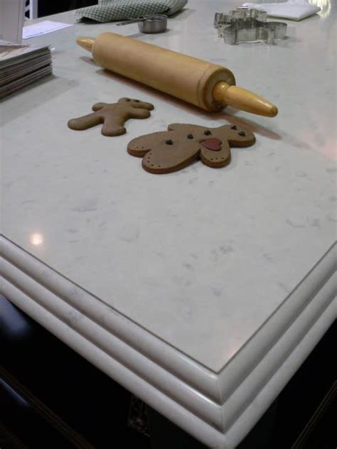 It features honed white carrera marble with an ogee edge around the perimeter. Caesarstone Countertops - Misty Carrera: http://www ...