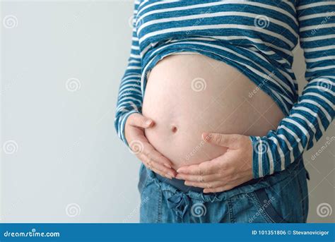 Pregnant Woman Touching And Rubbing Her Belly Stock Photo Image Of