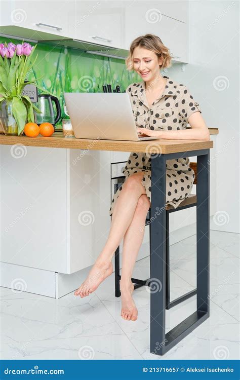 Woman Working At Home Office She Is Sitting In The Kitchen With Her Laptop Stock Image Image