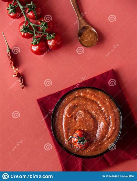 Tomato Soup On A Red Background With Tomatoes Top View Stock Photo