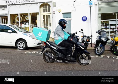 Deliveroo Delivery Service Courier Motorcycle Rider In Brighton Uk