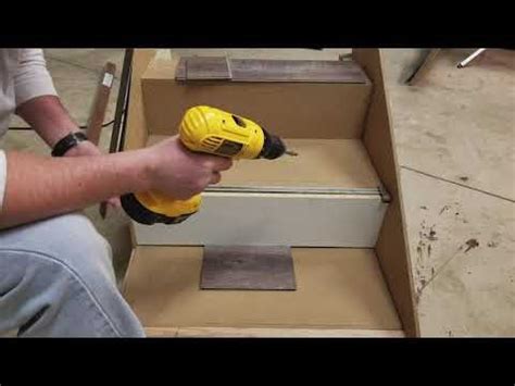 Set the stair tread into its proper position on the step, beginning at the nosing and pushing back firmly and as tightly as possible, holding up the back surface of the stair tread. Vinyl Overlap Stair Nose Installation Video | Zamma ...