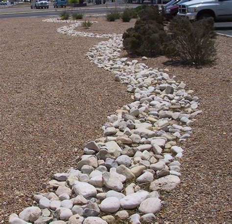 Dry Riverbed Landscape Rock Mix And Edge Plantings Dry Riverbed