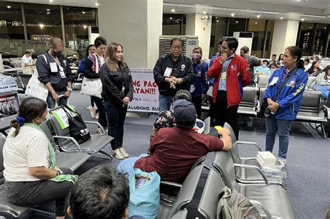 more filipinos from sudan arrive in manila abs cbn news