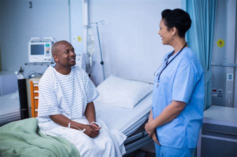 Premium Photo Nurse Interacting With Patient During Visit