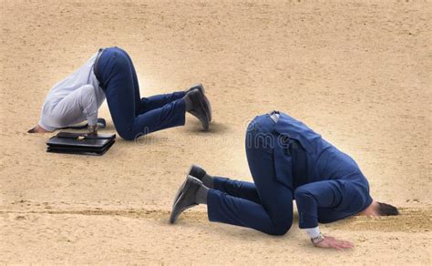 Businessman Hiding His Head In Sand Escaping From Problems Stock Photo