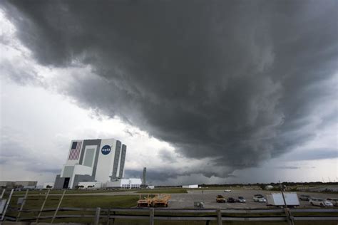Cape Canaveral Fla An Ominous Storm Cloud Hovers Over Launch