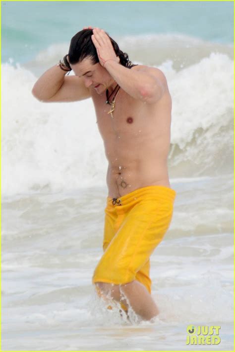 Orlando Bloom Shows Off His Soaking Wet Shirtless Body On The Beach With A Mystery Blonde