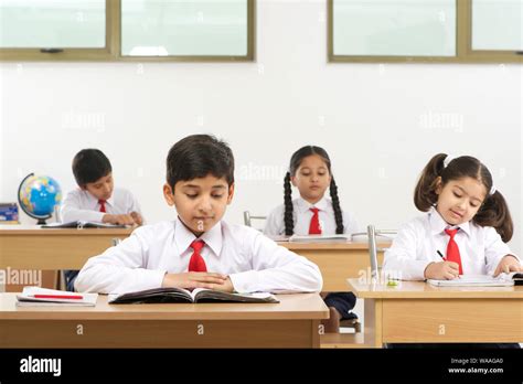 School Children Studying In A Classroom Stock Photo Alamy