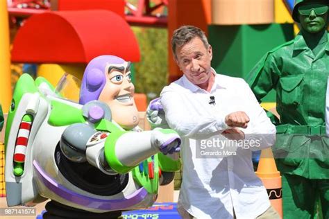 Tim Allen Poses With Buzz Lightyear For Toy Story Land Photos And