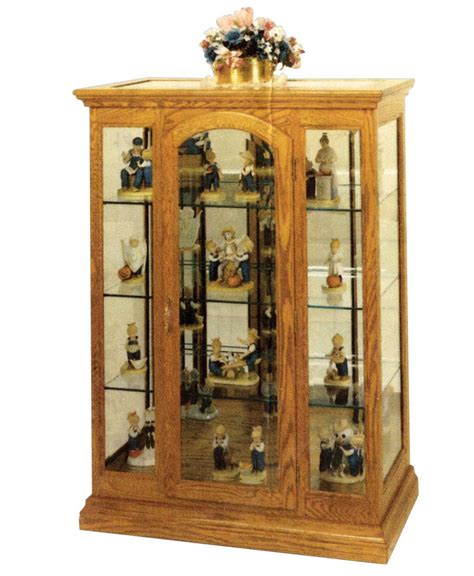 They are mostly used to showcase and store collectibles and antiques. Curio Cabinet with a Beveled Glass Inlay - Amish Direct