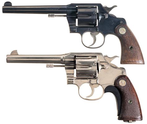Two Colt Double Action Revolvers A Colt Official Police Heavy Barrel