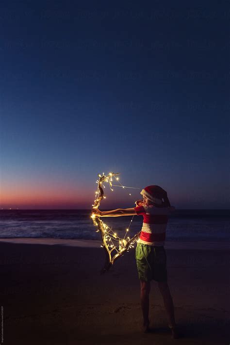 Playing With Christmas Lights At The Beach After Sunset By Angela Lumsden