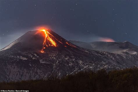Mount Etna Erupts Sending Lava And Huge Column Of Gas Into Night Sky