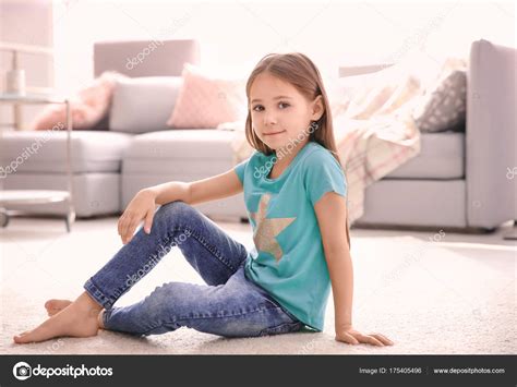 Cute Little Girl Sitting Floor Home Stock Photo By ©belchonock 175405496
