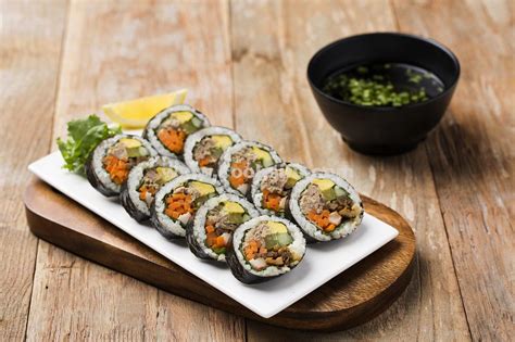 Once the whole row is done, roll up the first seaweed snack and press the edge to seal. Korean Seaweed Rice Rolls (Gimbap/Kimbap) - CookSifu ...