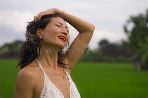 Outdoors Holidays Portrait Of Attractive And Happy Middle Aged Asian Korean Woman In White Dress
