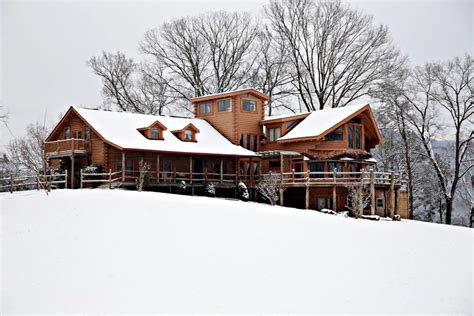 The georgia is a traditionally designed log cabin with cylinder locking double doors and covered patio area with balustrade infill sides. Group Cabin near Chickamauga, Georgia