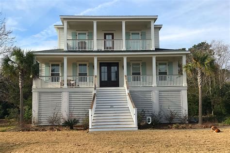 Home designs from 65 residential architects & designers who specialize in coastal home plans, beach house plans & lake home designs. Stuart Landing is an elevated house design with large ...