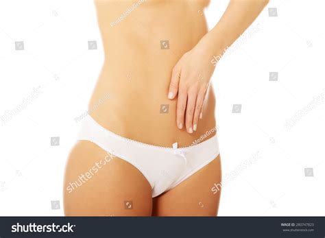 Woman Touching Her Belly And Massaging Stock Photo