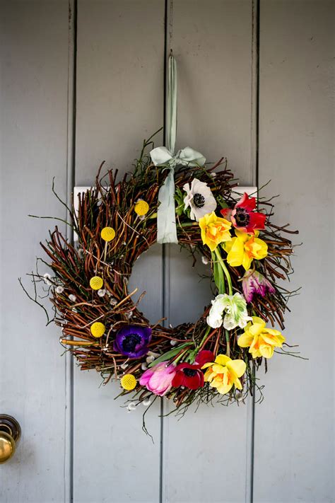 I fasten the look on the hook and then pull the string up and over the door. Make a Spring Wreath - Housewife Confidential