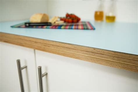I finish the table top with an oak trim using some offcuts from some salvaged hat and coat stands, and coat it in superior danish oil and some rustic pine briwax. Aqua Formica and birchply kitchen worktop | Plywood ...