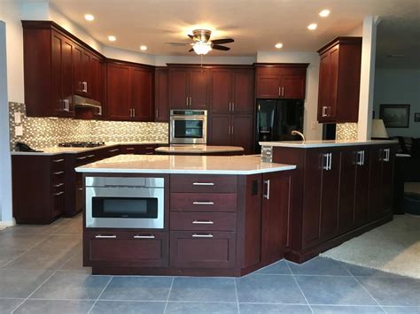 Cabinets are essential to any bathroom or kitchen layout and design. Bright kitchen with dark cabinets and white countertops | Bay Area Kitchens