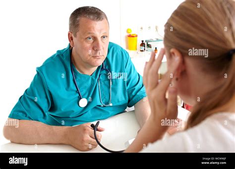 Nurse Examining Patient In Hospital Stock Photo Alamy