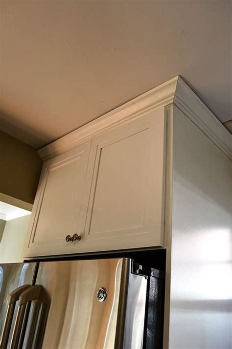 I finally finished adding the baseboard molding to the kitchen cabinets. Adding Crown Molding to Kitchen Cabinets | RenoCompare