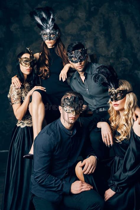 Group Of People In Masquerade Carnival Mask Posing In Studio Stock Photo Image Of Face Hide