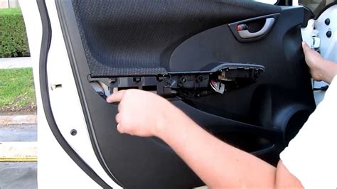 To remove the door panel, one of the things you must do is to remove the seat control/trim unit on the door. DIY Honda Fit Door Panel Removal - YouTube