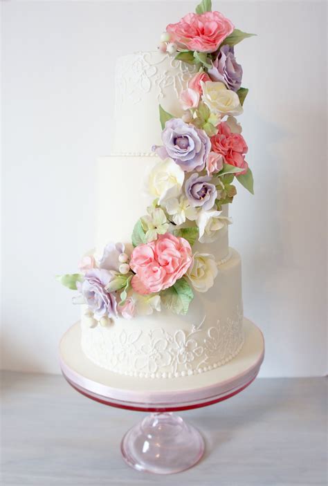 spring sugar flowers wedding cake with floral cascade and lace detail pastels wedding cakes