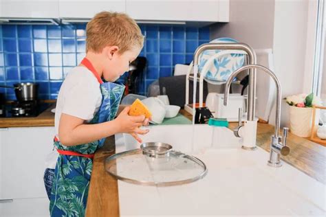 Boy Doing The Dishes Stock Photo By ©denizo 11670556