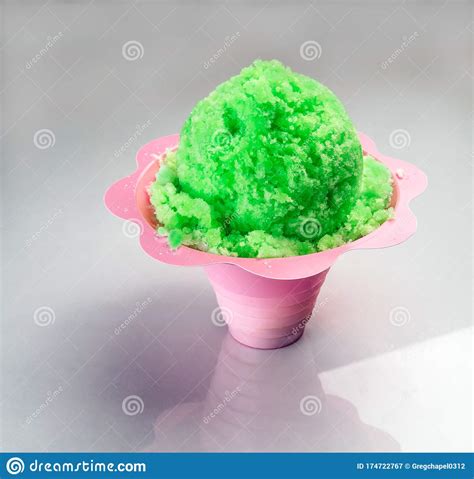 Lime Green Hawaiian Shave Ice Shaved Ice Or Snow Cone Dessert In A Flower Cup Stock Image