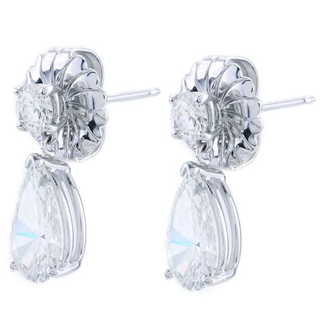 Round Diamond Stud Earrings With Pear Shaped Diamond Drops In White