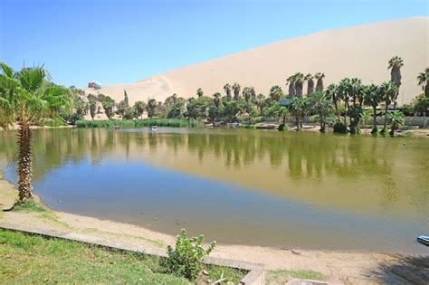 Premium Photo Natural Lagoon Of Huacachina Oasis Town Surrounded By