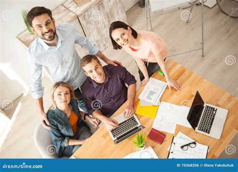 Cute Four Workers Are Expressing Positive Emotions Stock Photo Image