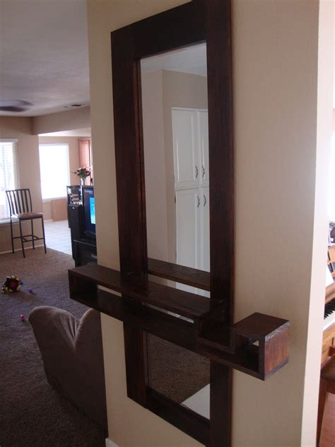 When the front door is opened, the mirror reflects it and enhances the light that pours into the hall, down the step and onto the polished wood floor of a. Thinking Out Loud: New Entryway Mirror with Floating Shelf