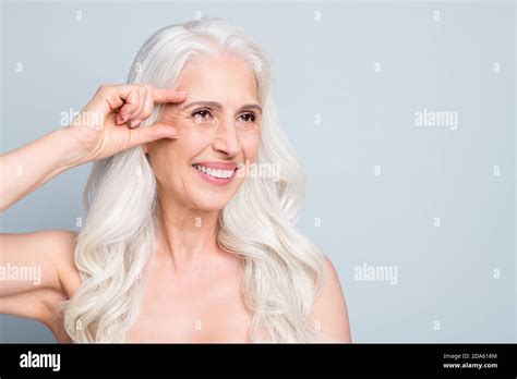 Close Up Portrait Of Attractive Cheery Grey Haired Elderly Lady Showing Place Injection Oval