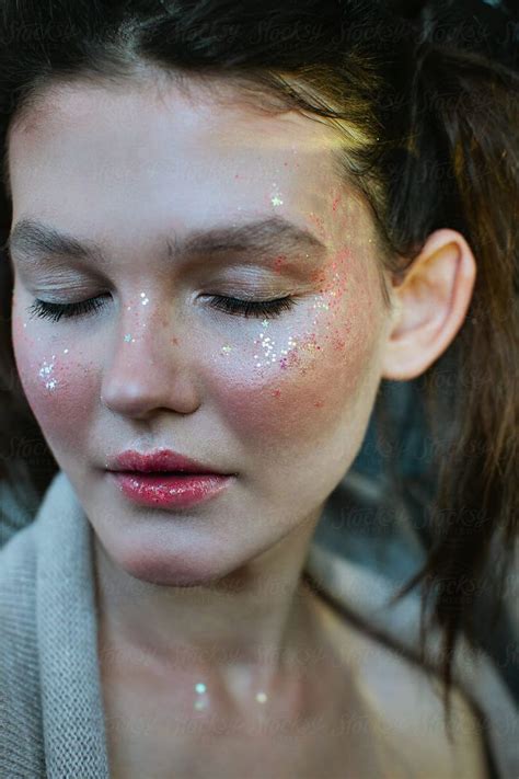 Portrait Of Girl With Sparkling Glitter On Her Face Stocksy United