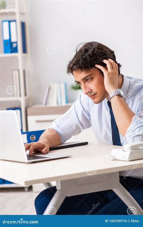 The Young Handsome Businessman Working In Office Stock Photo Image Of